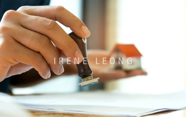 close-up-rubber-stamp-and-model-house-in-hand-2026-03-17-04-47-30-utc